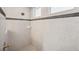 Modern bathroom with tile surround shower and gold fixtures at 17802 Mission Oak Dr, Lithia, FL 33547