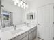 Bright bathroom with double sink vanity and modern fixtures at 17802 Mission Oak Dr, Lithia, FL 33547