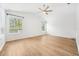 Bright bedroom featuring vaulted ceilings and hardwood floors at 17802 Mission Oak Dr, Lithia, FL 33547