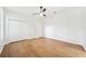 Light and airy bedroom with hardwood floors and a closet at 17802 Mission Oak Dr, Lithia, FL 33547