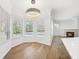 Sunlit breakfast nook offering views of the pool and direct access to the living area at 17802 Mission Oak Dr, Lithia, FL 33547