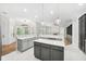 Gourmet kitchen features an island, stainless appliances, and a breakfast nook with backyard view at 17802 Mission Oak Dr, Lithia, FL 33547
