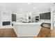 Spacious kitchen with island, stainless steel appliances, and sleek cabinetry with white countertops at 17802 Mission Oak Dr, Lithia, FL 33547