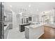 An open-concept kitchen featuring a large island, stainless appliances, and modern cabinetry at 17802 Mission Oak Dr, Lithia, FL 33547
