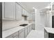 Well-lit kitchen features modern appliances, stylish cabinetry, and white countertops at 17802 Mission Oak Dr, Lithia, FL 33547
