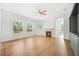 Inviting living room featuring fireplace, windows, and attractive built-in shelving at 17802 Mission Oak Dr, Lithia, FL 33547