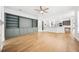 Open-concept living room with stylish built-ins flowing into the kitchen at 17802 Mission Oak Dr, Lithia, FL 33547