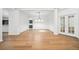 Spacious living room offers hardwood floors and modern lighting fixtures at 17802 Mission Oak Dr, Lithia, FL 33547