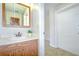 Bright bathroom with a vanity and a view to the hallway at 1799 N Highland Ave # 185, Clearwater, FL 33755