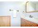 Functional bathroom featuring a wooden vanity, towel rack, and neutral color palette at 1799 N Highland Ave # 185, Clearwater, FL 33755