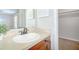 Bathroom vanity with classic fixtures and decorative plant, and access to a walk in closet at 1799 N Highland Ave # 185, Clearwater, FL 33755