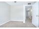 Bedroom with carpet flooring, and entrance to other rooms at 1799 N Highland Ave # 185, Clearwater, FL 33755