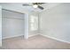 Bedroom with window, carpet flooring and closet with hanging rack at 1799 N Highland Ave # 185, Clearwater, FL 33755