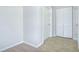 Clean and bright foyer featuring neutral paint, closet, and durable flooring at 1799 N Highland Ave # 185, Clearwater, FL 33755