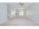 Spacious living room with stairs leading to bedrooms and ceiling fan at 1799 N Highland Ave # 185, Clearwater, FL 33755