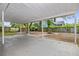 Covered patio and backyard with fire pit, great for outdoor entertaining at 2204 E Idlewild Ave, Tampa, FL 33610