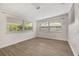 Bright bonus room with neutral walls, new floors, and lots of windows at 2204 E Idlewild Ave, Tampa, FL 33610