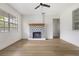 Bright living room featuring a unique fireplace and ample natural light at 2204 E Idlewild Ave, Tampa, FL 33610