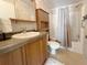 Functional bathroom featuring a single sink vanity, ample storage, and a shower with a curtain at 250 S Port Royal Ln, Apollo Beach, FL 33572