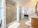 Cozy bathroom with a shower and clear view of a main bedroom through the open doorway at 250 S Port Royal Ln, Apollo Beach, FL 33572