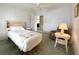 Comfortable bedroom featuring a bed, side table, and cozy armchair offering a relaxing retreat at 250 S Port Royal Ln, Apollo Beach, FL 33572