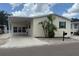 Charming single-story home with a carport, tidy landscaping, and classic design, creating a welcoming curb appeal at 250 S Port Royal Ln, Apollo Beach, FL 33572