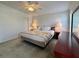 Relaxing main bedroom with a ceiling fan, dresser, and a plush bed adorned with floral accents at 250 S Port Royal Ln, Apollo Beach, FL 33572
