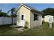 Exterior view of charming outbuilding with traditional siding and minimalist landscaping at 250 S Port Royal Ln, Apollo Beach, FL 33572