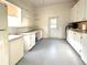 Large utility room, featuring ample counter space and storage, perfect for projects and organization at 250 S Port Royal Ln, Apollo Beach, FL 33572