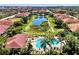 Aerial view of community pool, amenities, and lush landscaping at 2527 Terracina Dr, Venice, FL 34292