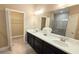 Spacious bathroom with double vanity and walk-in closet at 2527 Terracina Dr, Venice, FL 34292