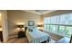 Comfortable bedroom with large windows, a queen-sized bed and neutral decor at 2527 Terracina Dr, Venice, FL 34292