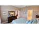 Bedroom featuring a queen-sized bed, neutral decor and ample closet space at 2527 Terracina Dr, Venice, FL 34292