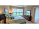Bright bedroom with large window and view of green lawn at 2527 Terracina Dr, Venice, FL 34292
