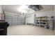 Spacious garage has automatic door, with room for storage and work area at 2527 Terracina Dr, Venice, FL 34292