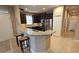 Modern kitchen with stainless steel appliances, granite countertops, and ample cabinet space at 2527 Terracina Dr, Venice, FL 34292