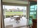 Relax on the screened lanai overlooking a serene pond and lush landscaping at 2527 Terracina Dr, Venice, FL 34292