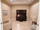 A cozy home office with a built-in desk, overhead storage, and comfortable seating area at 2527 Terracina Dr, Venice, FL 34292