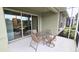Screened patio with seating area, overlooking a serene outdoor space at 2527 Terracina Dr, Venice, FL 34292
