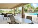 Inviting community pool with covered seating area, perfect for entertaining or relaxation at 2527 Terracina Dr, Venice, FL 34292