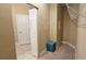 Walk-in closet with metal shelving, stool, and view to hallway and bathroom at 2527 Terracina Dr, Venice, FL 34292