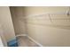 Walk-in closet with shelving and carpeted floor at 2527 Terracina Dr, Venice, FL 34292