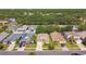 An overhead shot showcasing the single-story home's location within a community of lush landscaping and mature trees at 2609 Rosehaven Dr, Wesley Chapel, FL 33544