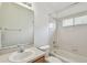 Bright bathroom with a shower-tub combo and a large mirror over the vanity at 2609 Rosehaven Dr, Wesley Chapel, FL 33544