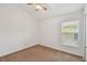 Bedroom featuring carpeted floors, fan and window at 2609 Rosehaven Dr, Wesley Chapel, FL 33544