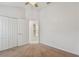 Bedroom with carpeted floors, fan, and closet at 2609 Rosehaven Dr, Wesley Chapel, FL 33544