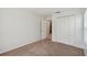 Bright bedroom features carpeted flooring and a large closet for ample storage at 2609 Rosehaven Dr, Wesley Chapel, FL 33544