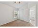 Bedroom with carpeted floors and walk-in closet at 2609 Rosehaven Dr, Wesley Chapel, FL 33544