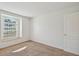 Cozy bedroom offers natural light from a large window and neutral carpet at 2609 Rosehaven Dr, Wesley Chapel, FL 33544