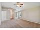 Carpeted bedroom with high ceilings, multiple windows, and ample space at 2609 Rosehaven Dr, Wesley Chapel, FL 33544